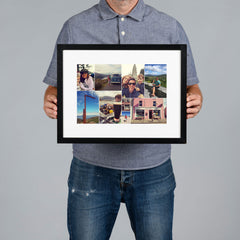 A man holds a bespoke framed custom photo collage print against a solid gray background.