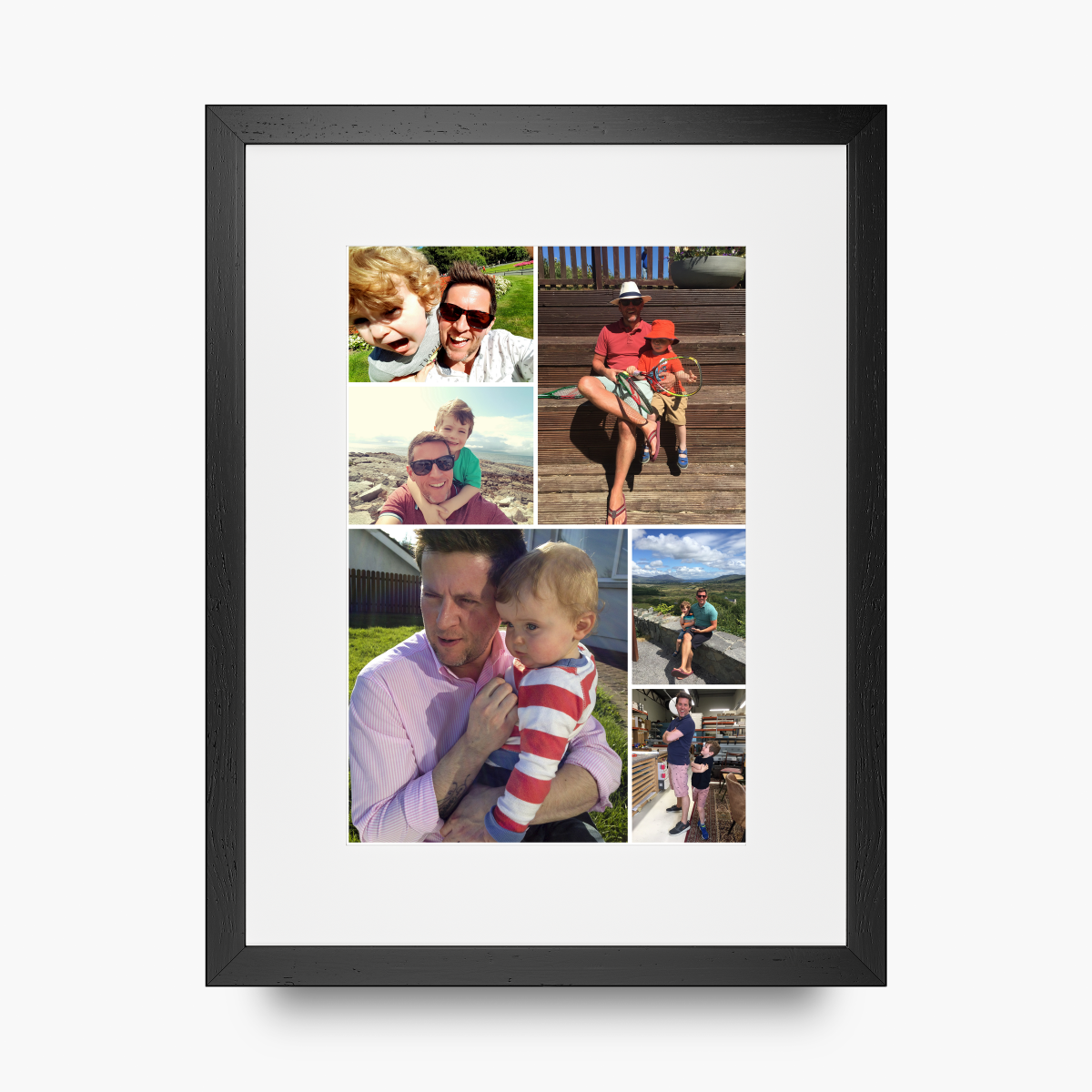 A framed custom family photo collage print with a black frame and white mat, showcasing multiple family portraits in a 3x2 grid on a light gray background.