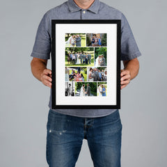 A man wearing a blue polo shirt and jeans holds a custom black framed photo collage print of wedding photographs.  The print is 20x30cm and the frame is 34x44cm. 