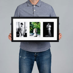 A man holds a black-framed triptych photo print with white matting. The three vertical photos inside the frame show a man in a suit, a couple in a garden, and a black-and-white portrait.